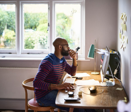 Man working on computer at home